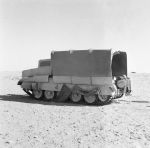 A_Crusader_tank_with_its__sunshield__lorry_camouflage_erected2C_26_October_1942__E18461.jpg