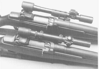 M1D sniper rifle with M84 scope is shown above an M1C sniper rifle with M81/M82 scope.
